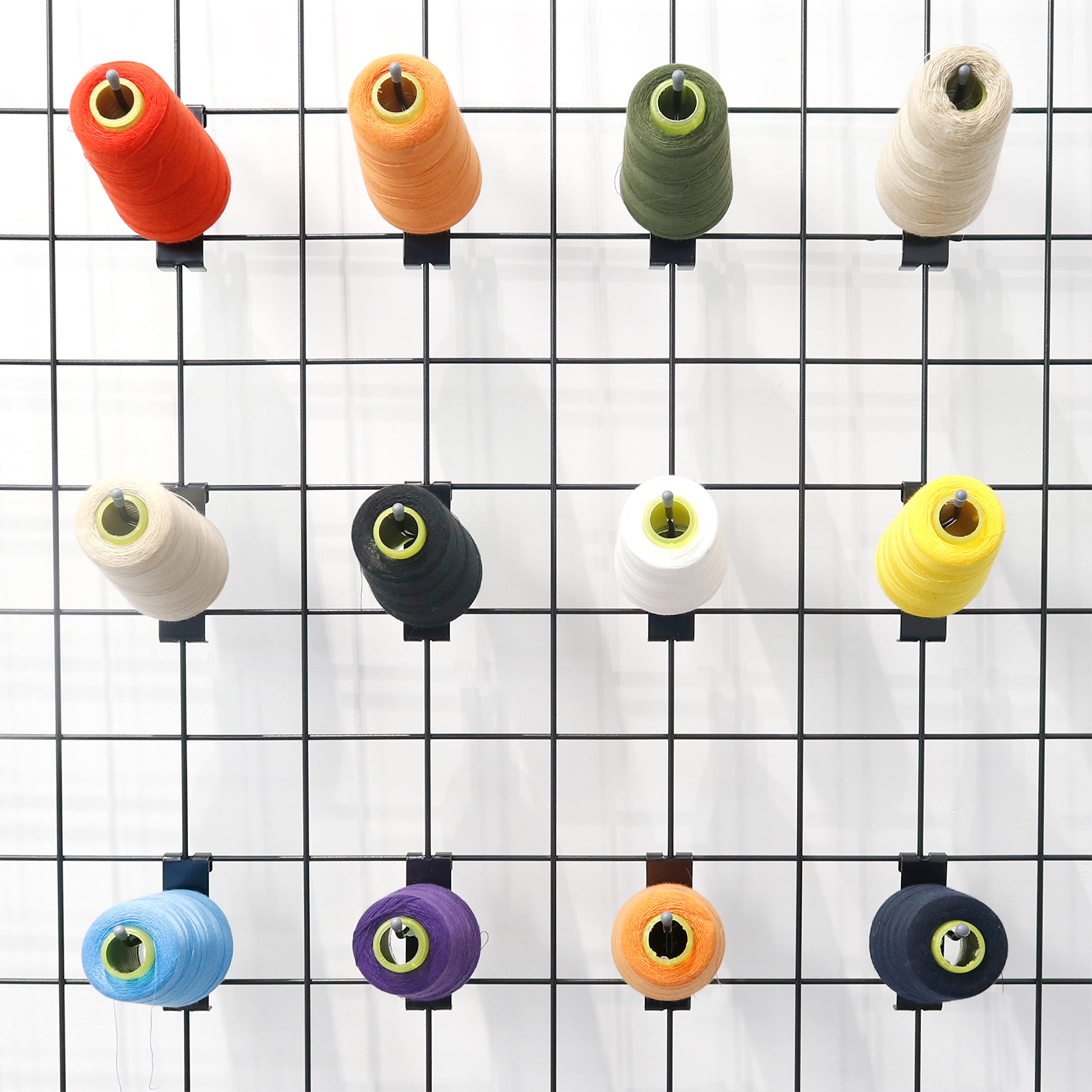 This image shows a grid display of various colored thread spools organized in a neat arrangement. The spools come in a range of vibrant colors including red, orange, yellow, green, blue, purple, and black.