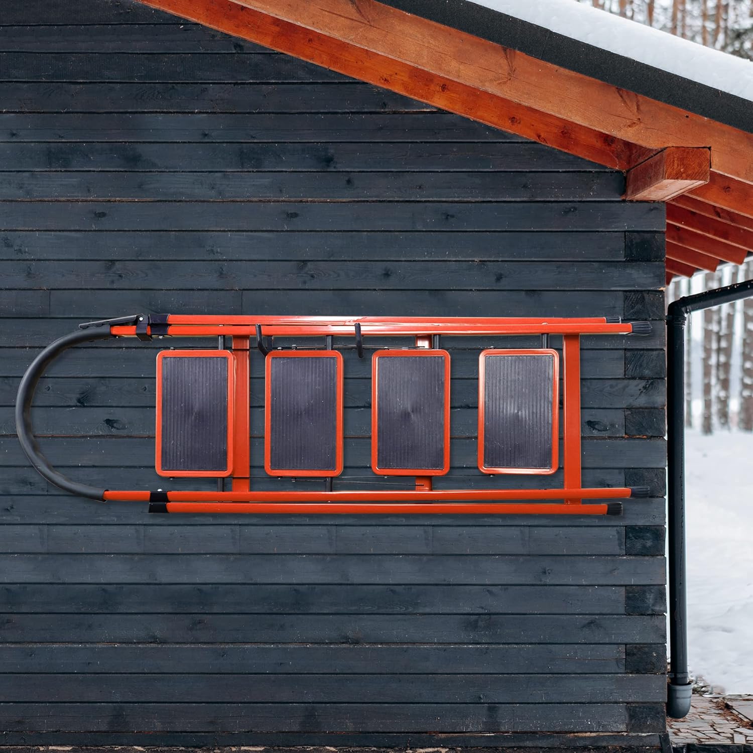 This image shows a set of Huhole pegboard hooks mounted on a wooden wall. The hooks are made of a bright orange material, creating a striking visual contrast against the dark wood. The hooks appear to be designed to hold and organize various items, showcasing Huhole's functional and visually appealing storage solutions.