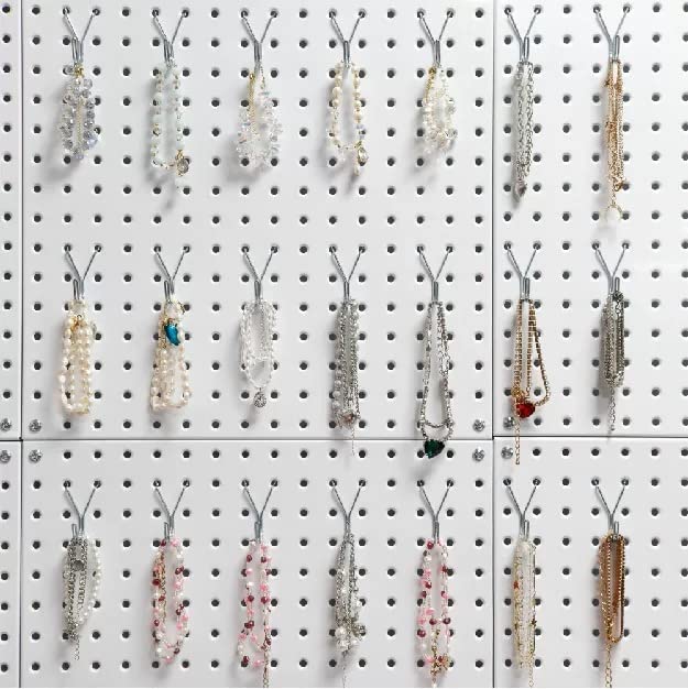 This image shows an extensive jewelry display organized on a pegboard.