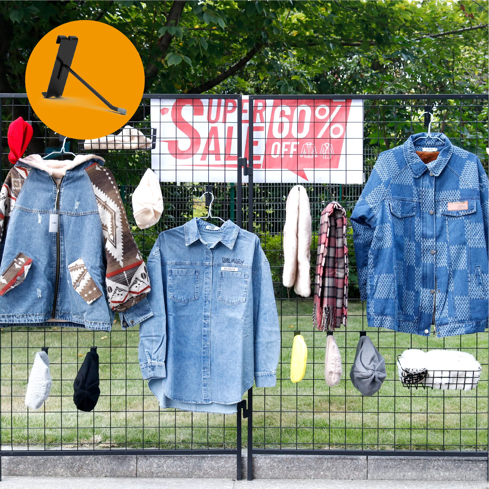 This image shows an outdoor display for a clothing store sale. The display features various denim and plaid shirts and jackets hanging on a wire mesh grid. 